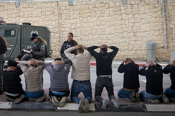 Israeli Border Police detain Palestinians who attempted to enter Israel illegally after hiding in a van at a checkpoint north of Jerusalem, March 30, 2026. (Chaim Goldberg/Flash90)
