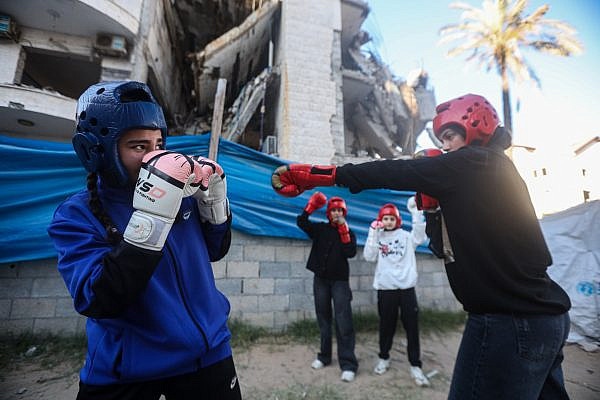 Palestinian girls box outside the makeshift training gym in the Al-Rimal displacement camp, in Gaza City, June 1, 2026. (Yousef Zaanoun)