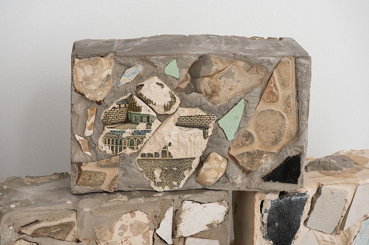 Concrete bricks embedded with shards salvaged from demolished homes in Al-Bustan, including one depicting the Dome of the Rock, seen at the exhibition "The Splinter" at Bezalel Academy of Arts and Design, Jerusalem. (Hadas Hay)