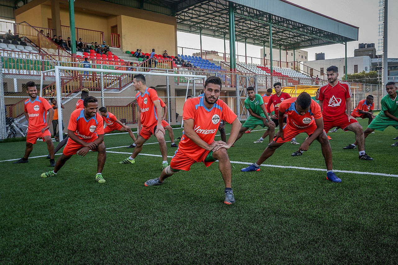 Palestinian players of the Khadamat Rafah Club take part in a training session in Rafah, southern Gaza Strip, September 26, 2019. (Abed Rahim Khatib/Flash90)