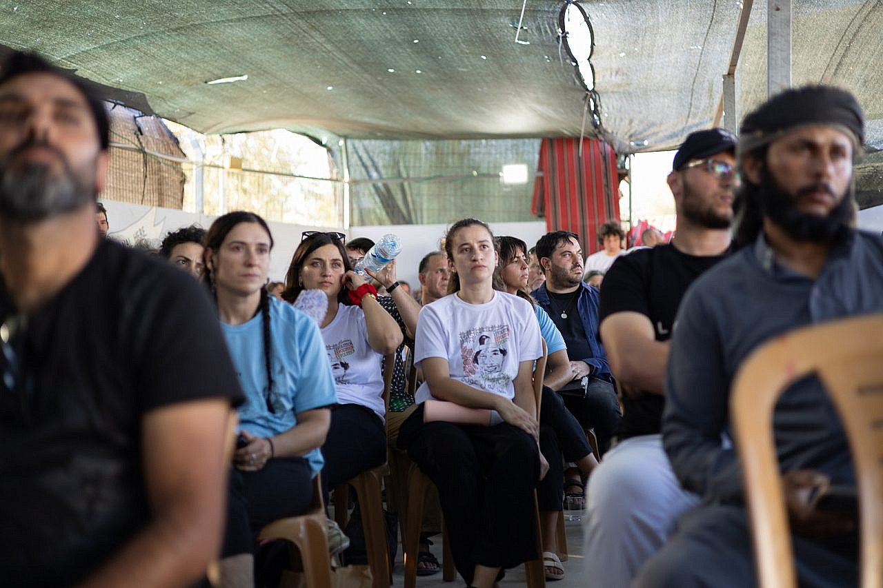 Friends of Awdah Hathaleen and activists gather for his memorial ceremony in the community center of Umm Al-Khair, Masafer Yatta, occupied West Bank, July 28, 2026. (Omri Eran-Vardi)