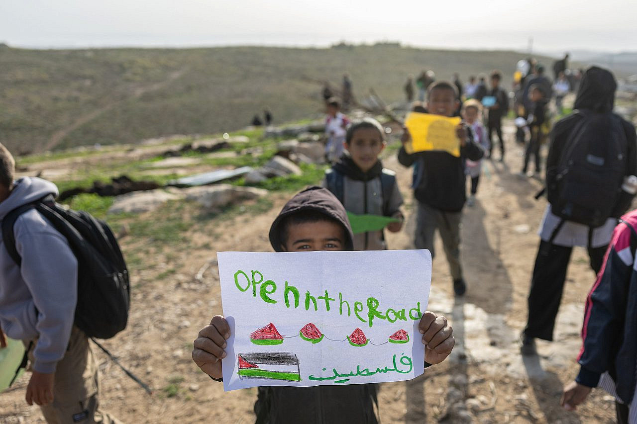 Children from Umm Al-Khair protest together with other residents after settlers blocked the only road leading to their school, April 16, 2026. (Activestills/Avishay Mohar)