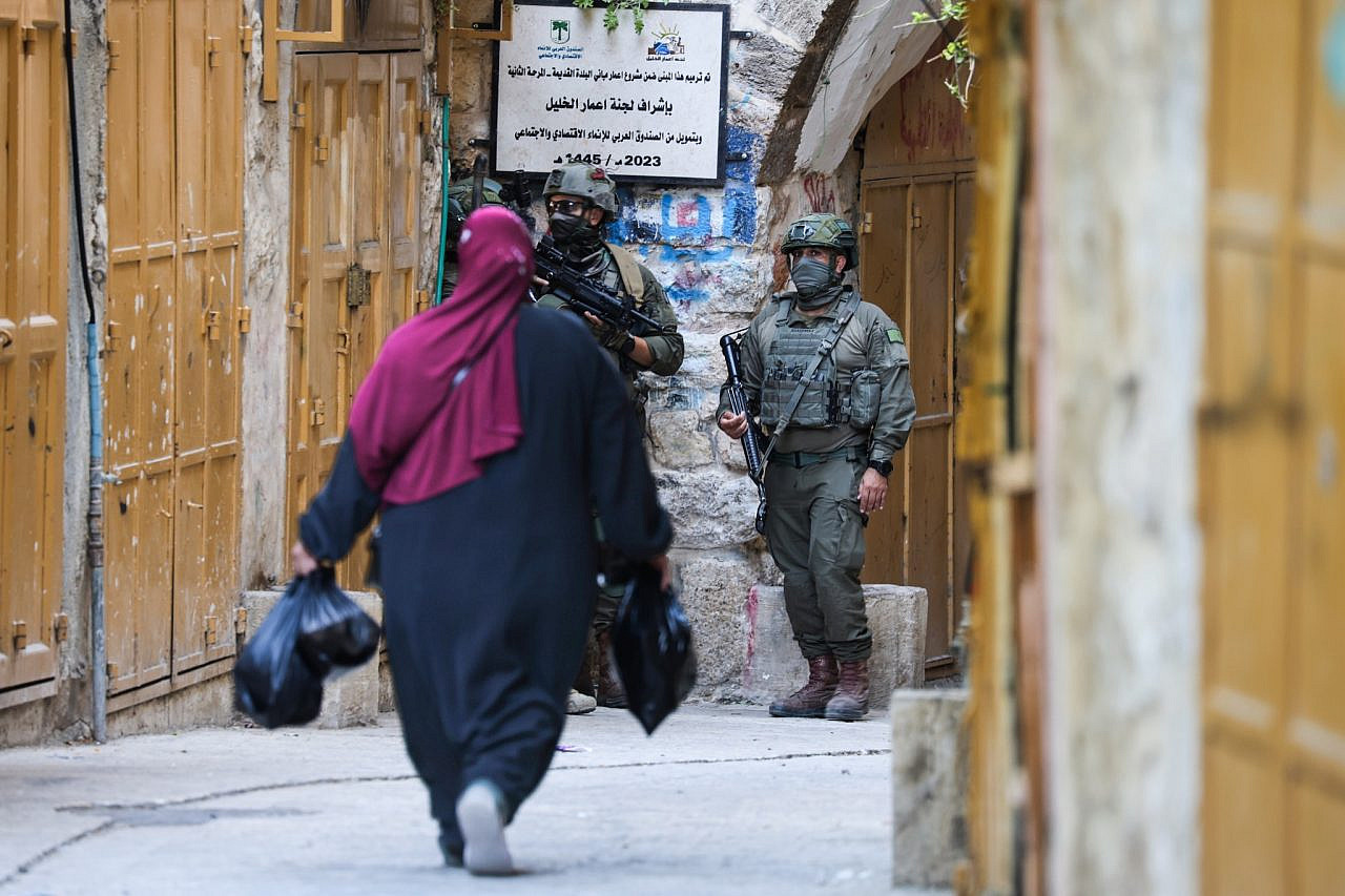 Israeli soldiers patrolling through the Old City of Hebron, in the occupied West Bank, 4 July 2026. (Mosab Shawer/Activestills)
