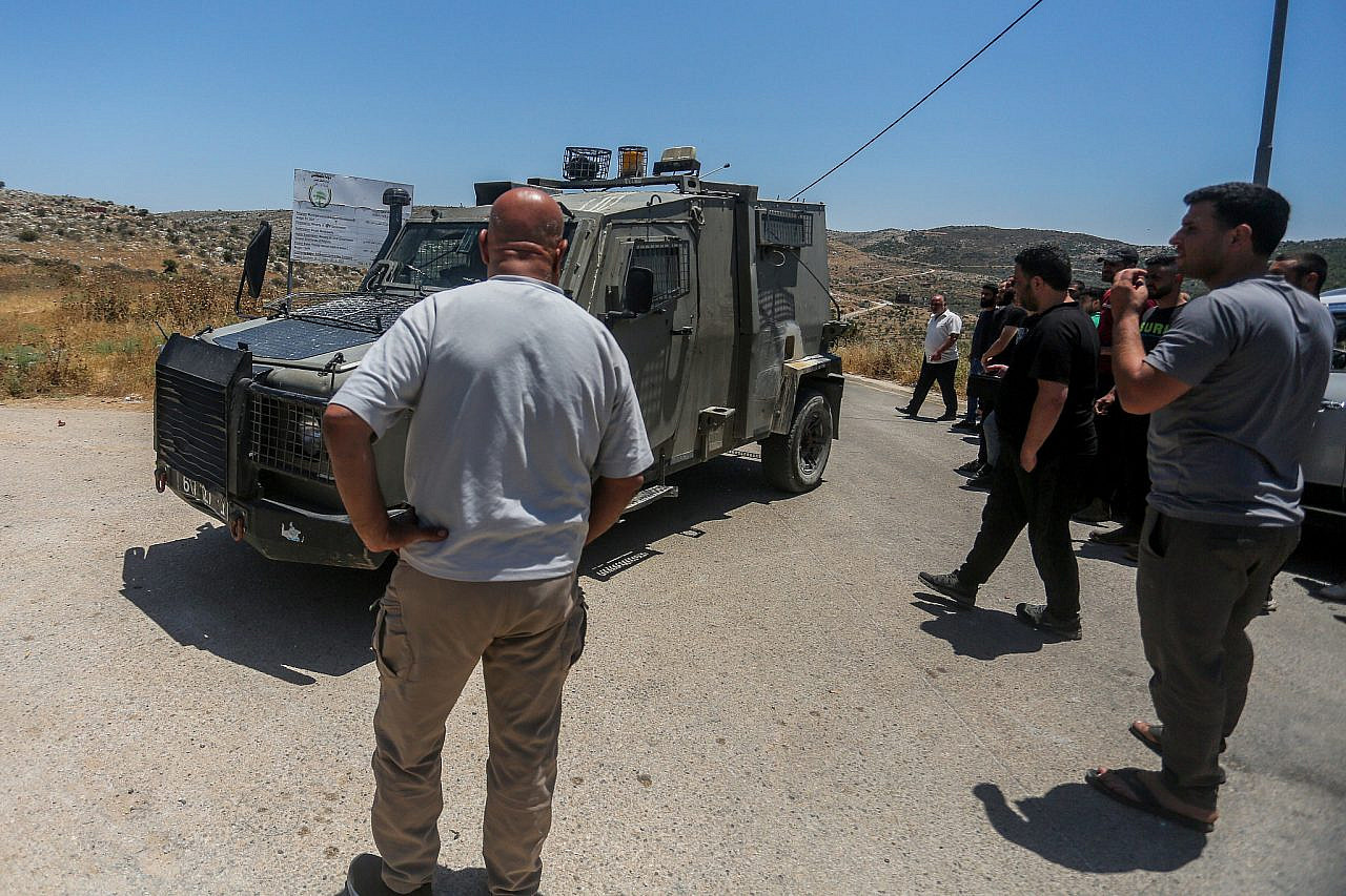 Israeli soldiers patrol outside the village of Bruqin, west of Salfit, in the northern West Bank, May 23, 2025. (Nasser Ishtayeh/Flash90)