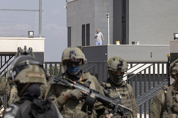 Qusai Abu Ridi is seen in his besieged home as Israeli soldiers block activists from reaching him, Qusra, occupied West Bank, August 14, 2026. (Oren Ziv)