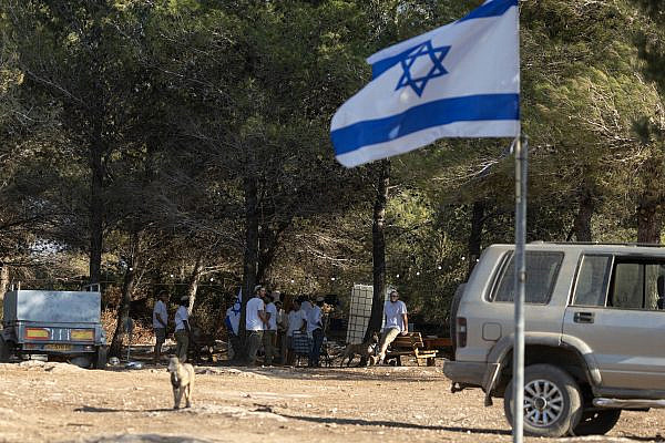 Israeli settlers seen at a new outpost next to the Palestinian town of Majd Al-Krum in the Galilee, northern Israel, September 13, 2026. (Oren Ziv)