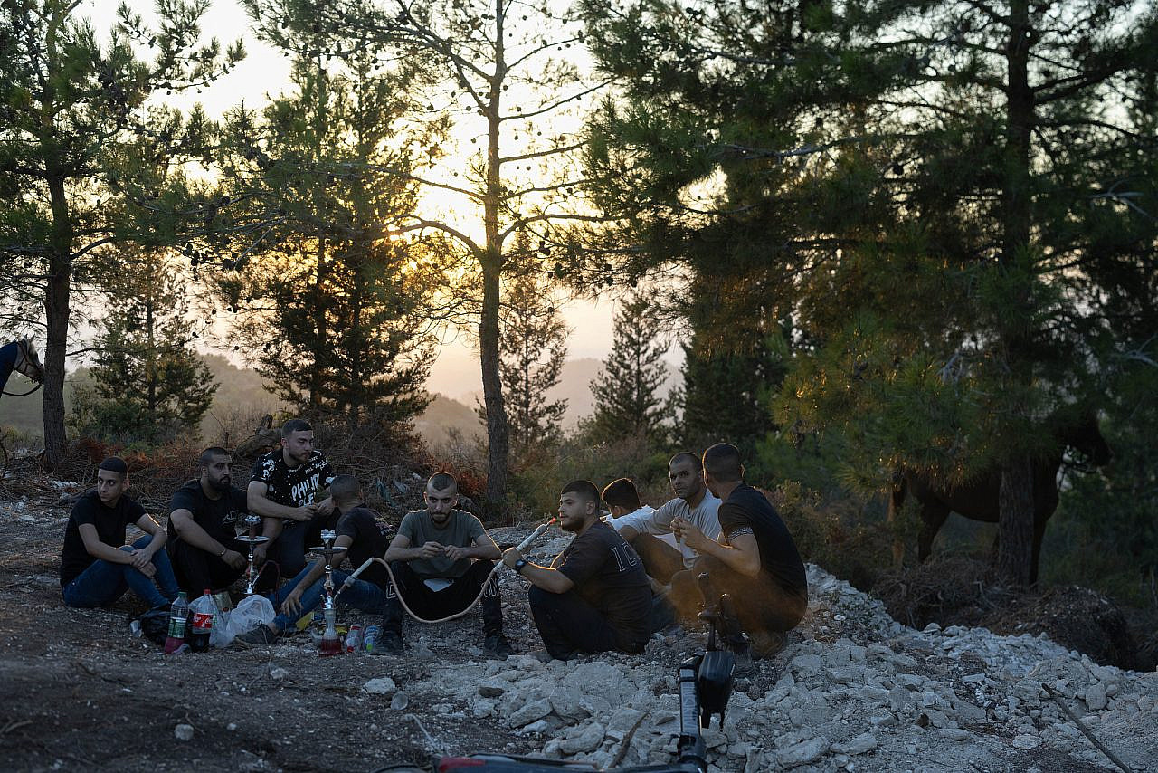Local Palestinian residents seen near a new Israeli settler outpost next to the Arab town of Majd Al-Krum in the Galilee, northern Israel, September 13, 2026. (Oren Ziv)