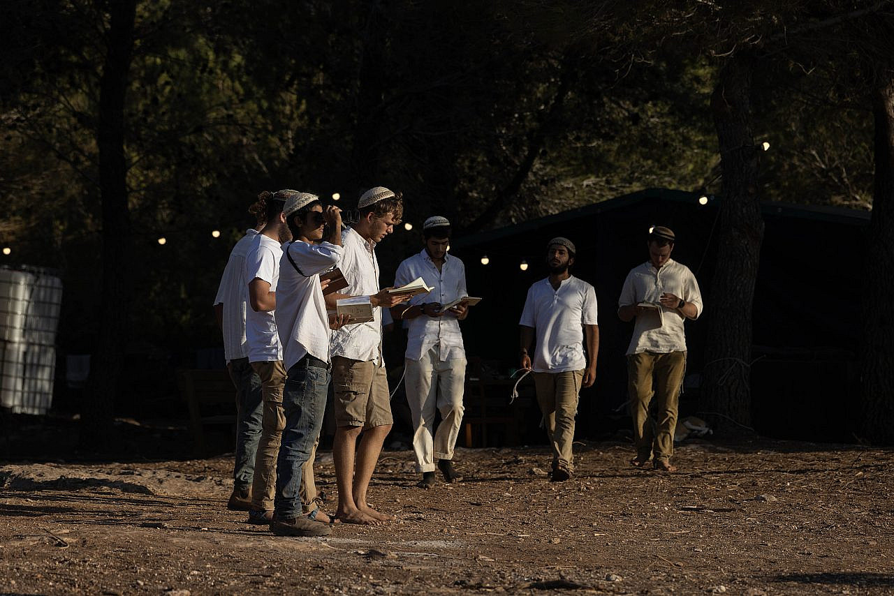 Israeli settlers seen at a new outpost next to the Palestinian town of Majd Al-Krum in the Galilee, northern Israel, September 13, 2026. (Oren Ziv)