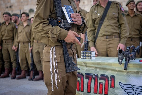 Israeli soldiers from Netzah Yehuda Battalion and family members attend a swearing-in ceremony at the Western Wall in Jerusalem's Old City, on July 10, 2024. Photo by Chaim Goldberg/Flash90