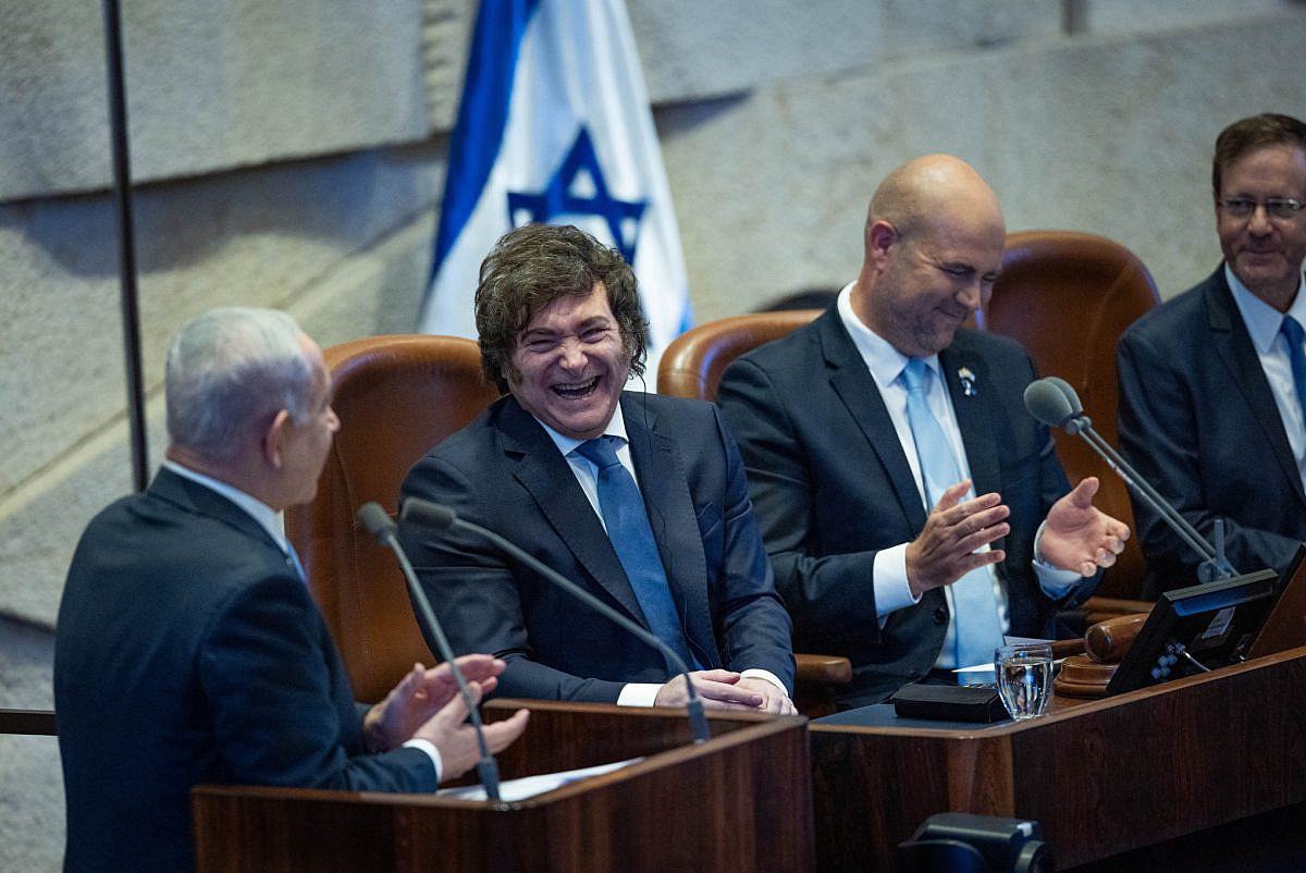 Argentinian President Javier Milei laughs alongside Israeli Prime Minister Benjamin Netanyahu, during a special Knesset session in Milei's honor, in Jerusalem, June 11, 2025. (Yonatan Sindel/Flash90) Argentinian President Javier Milei laughs alongside Israeli Prime Minister Benjamin Netanyahu, during a special Knesset session in Milei's honor, in Jerusalem, June 11, 2025. (Yonatan Sindel/Flash90)