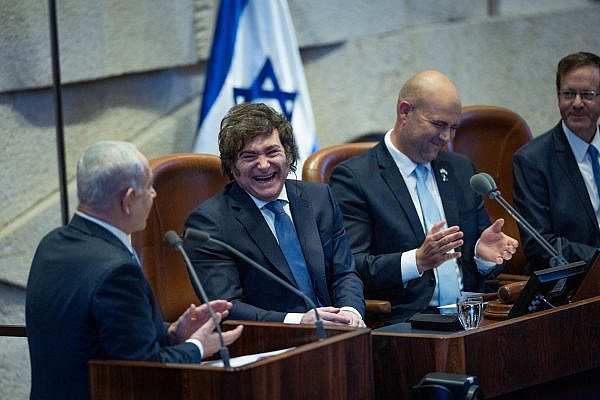 Argentinian President Javier Milei laughs alongside Israeli Prime Minister Benjamin Netanyahu, during a special Knesset session in Milei's honor, in Jerusalem, June 11, 2025. (Yonatan Sindel/Flash90)