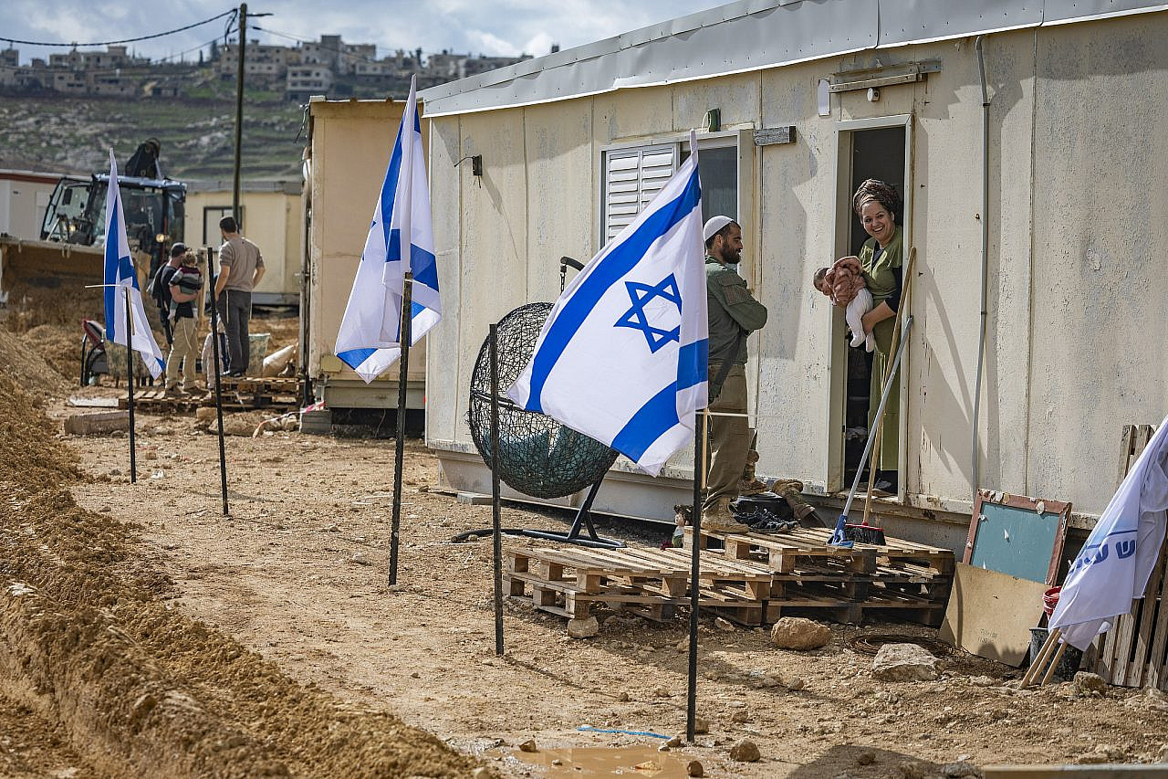 Israeli settlers seen in the newly established settlement of Yatziv in the Gush Etzion area of the occupied West Bank, January 19, 2026. (Chaim Goldberg/Flash90)