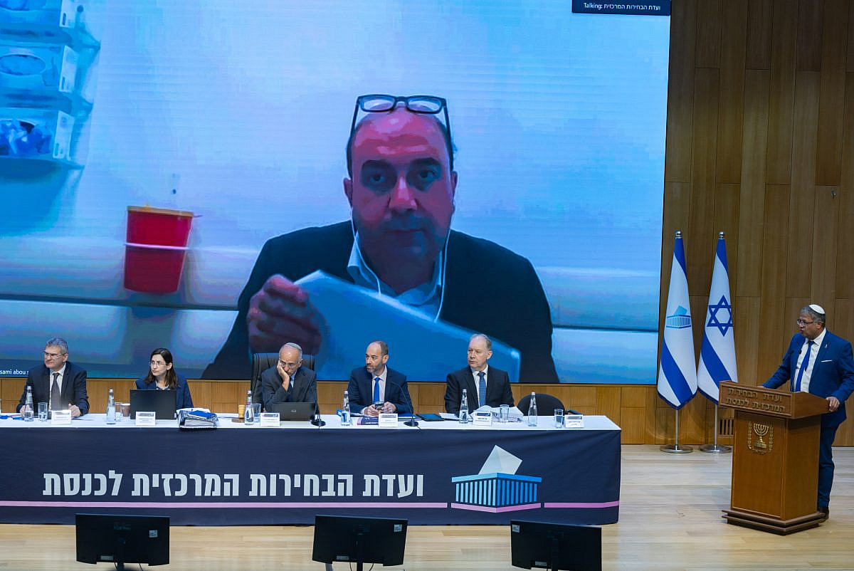 Balad chairman Sami Abu Shehadeh virtually joins a Central Elections Committee hearing on a request to disqualify him from the upcoming elections, at the Knesset in Jerusalem, September 23, 2026. (Yonatan Sindel/Flash90) Balad chairman Sami Abu Shehadeh virtually joins a Central Elections Committee hearing on a request to disqualify him from the upcoming elections, at the Knesset in Jerusalem, September 23, 2026. (Yonatan Sindel/Flash90)