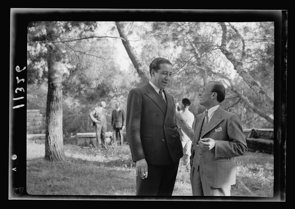 Yahya al-Lababidi (left), Subdirector of Arabic Music at the Palestine Broadcasting Service, with Palestinian poet Ibrahim Tuqan, at a reception in Jerusalem, April 20, 1940. (G. Eric and Edith Matson Photograph Collection/Library of Congress)