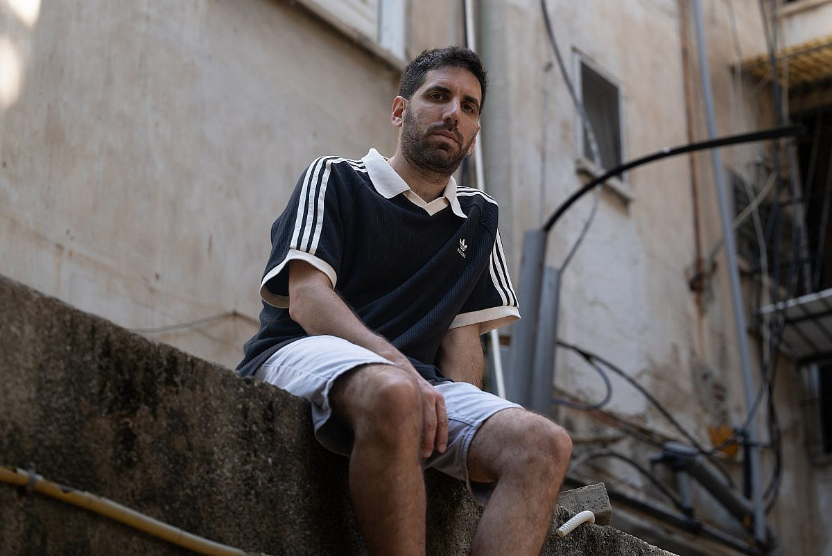 Regev Baruch outside his studio, Sept. 9. (Timna Rose Peretz)