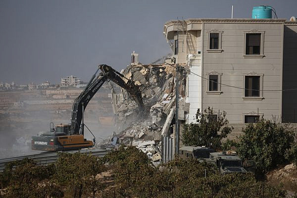 Israeli forces demolish homes in the Farsh Al-Hawa area of Hebron, following a deadly attack on a checkpoint nearby, West Bank, October 23, 2026. (Mosab Shawer/Activestills)